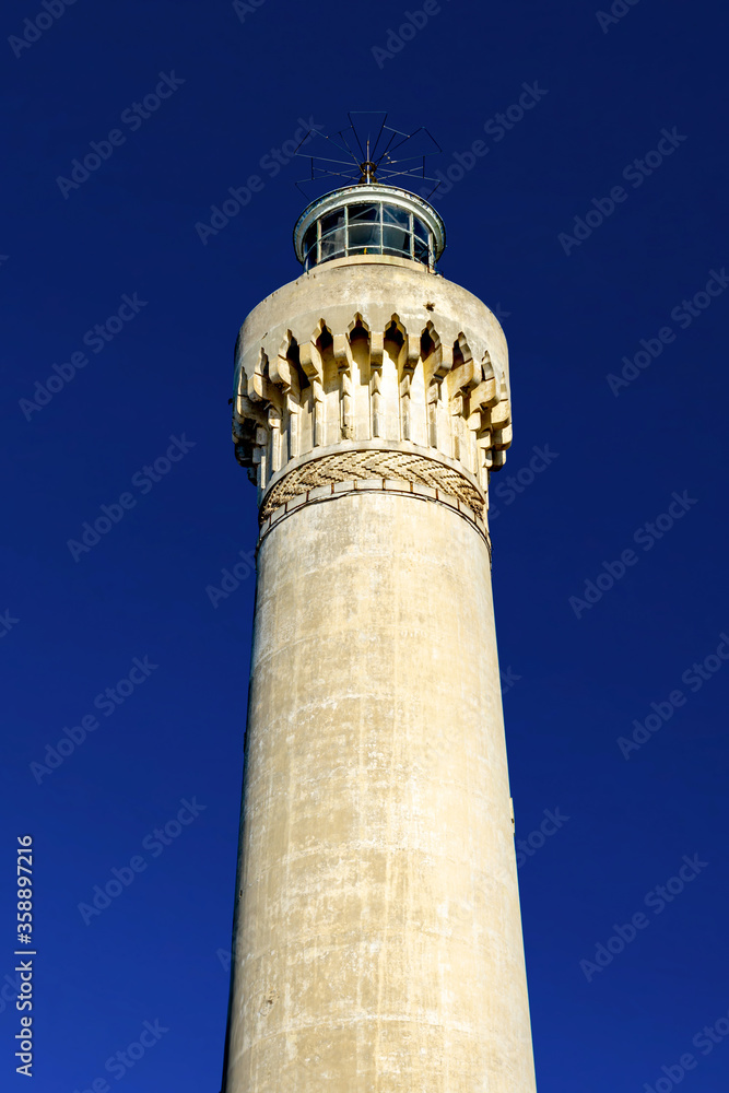 El Hank Lighthouse constructed in 1916, 50 m tall, abandoned facility.  - Casablanca, Morocco, taken in Dec 2019.