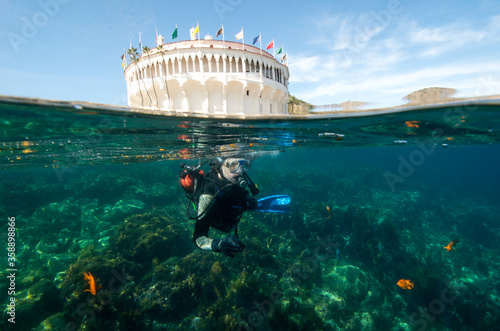 A Teenage Male Scuba a Diver Experiences the Underwater Beauty at Catalina Island in California photo