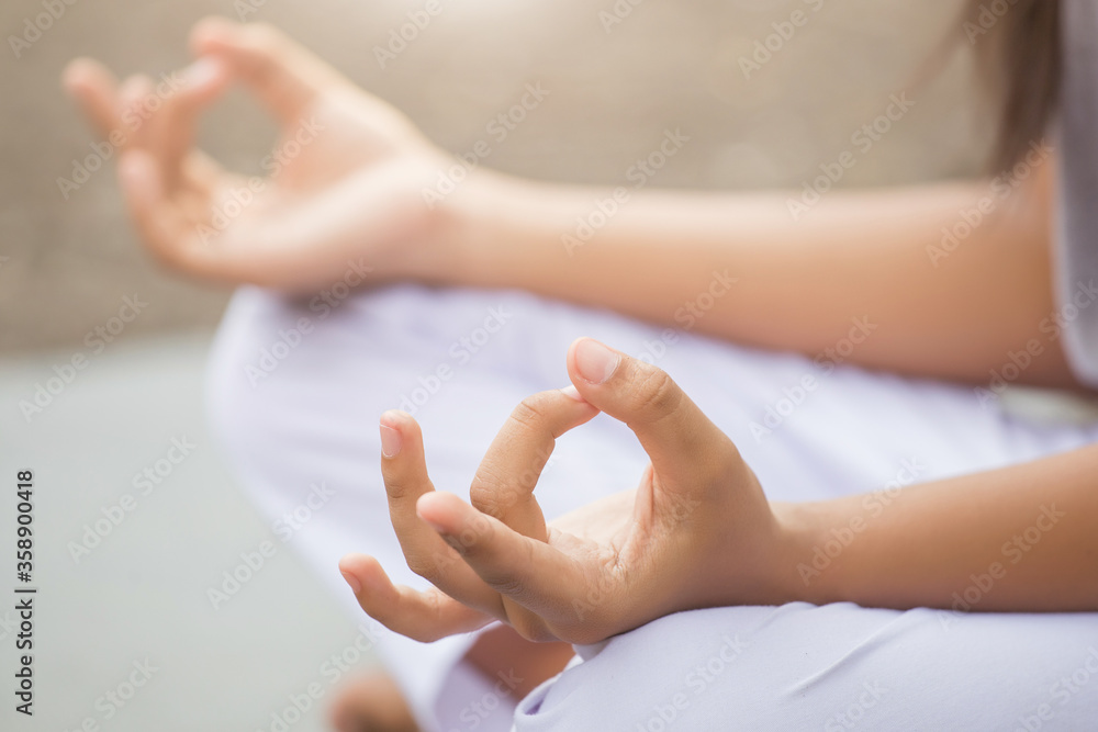 Naklejka premium woman enjoying meditation and yoga in the park