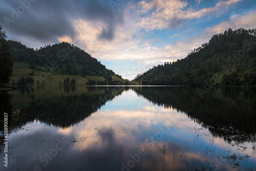 beautiful landscape sunset reflection over the lake and mountains