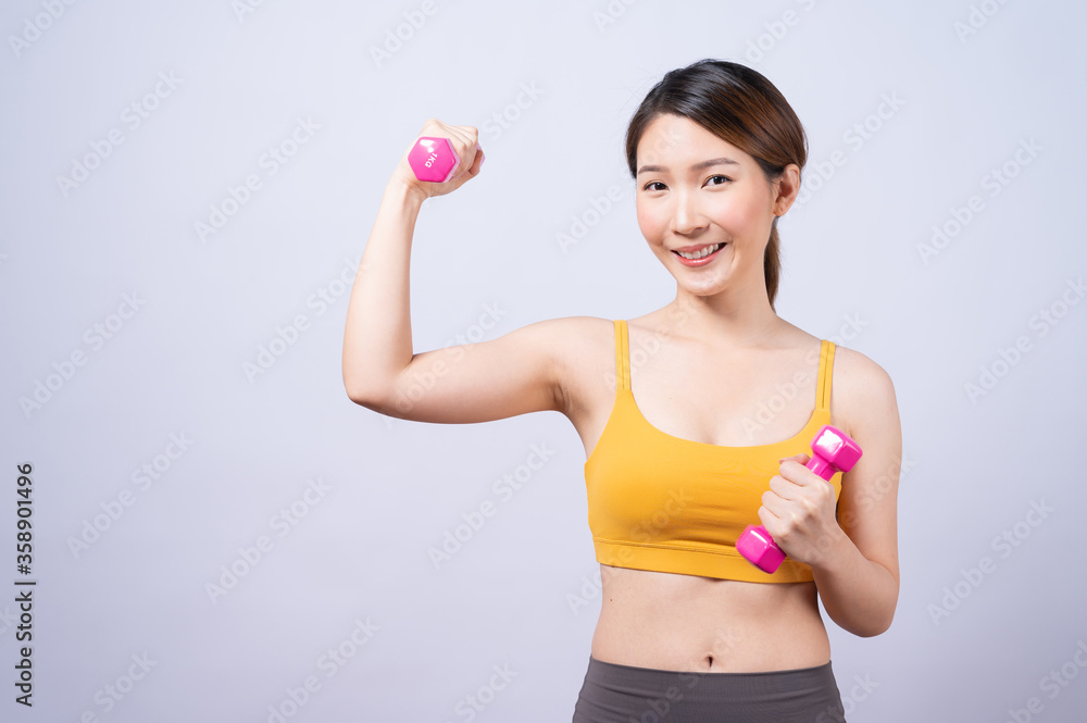 Asian sporty woman with dumbbell fit slim body isolated on white background. concept of healthy lifestyle. Asian sporty woman with dumbbell fit slim body isolated on white background. concept of healthy lifestyle.