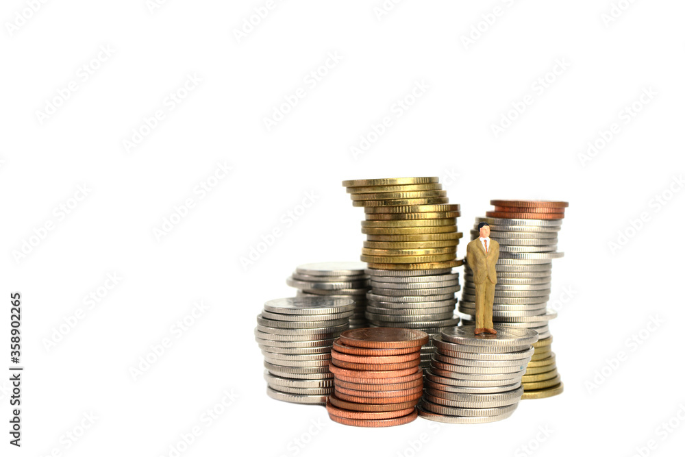 Miniature figures businessman on coins, on the white backgroud. Miniature figures businessman on coins, on the white backgroud.