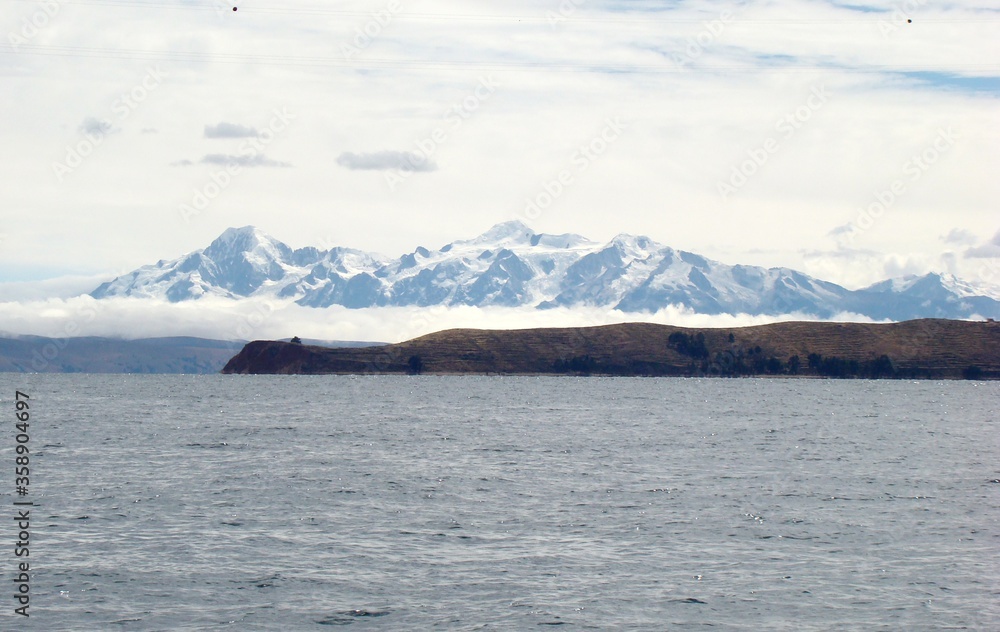 View from Isla del Sol to Isla de la Luna (Lake Titicaca, Bolivia) with Cordillera Real in the Background