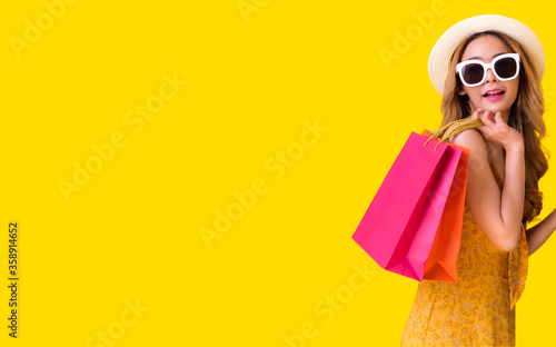 Cute Asian girl shopping for sale.She bought a lot of products from the discounted price.