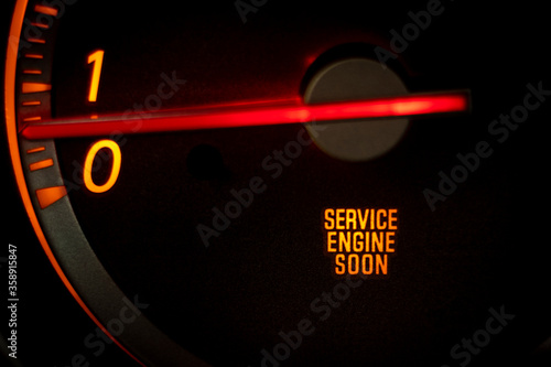 “SERVICE ENGINE SOON” light on dashboard of car in need of service or repair