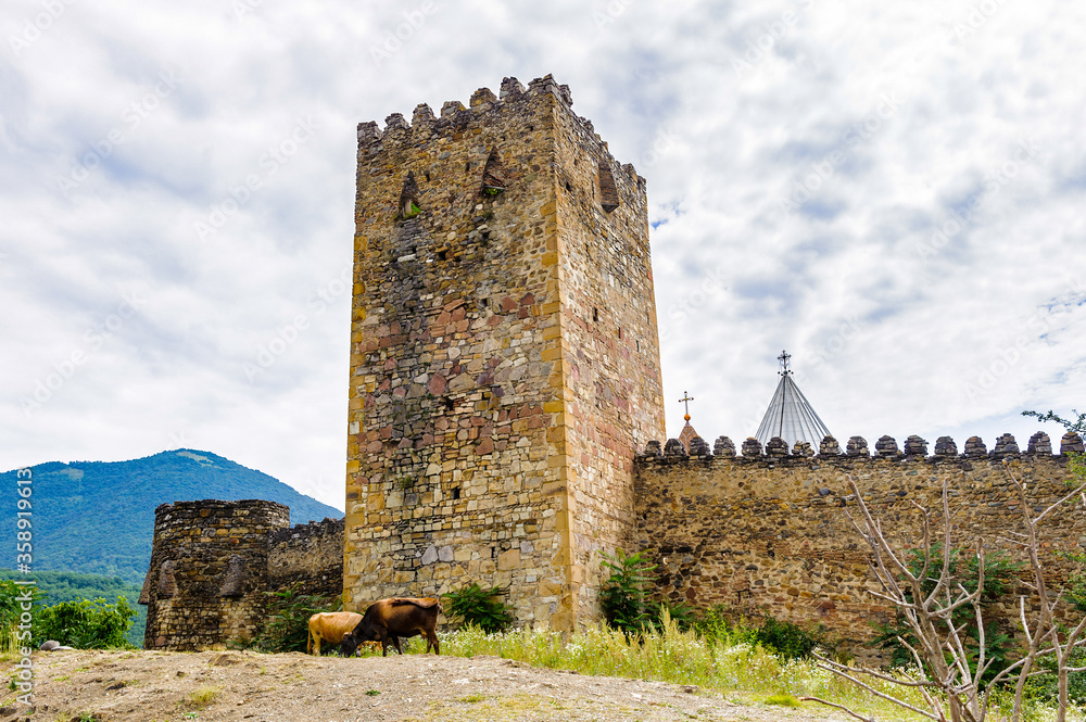 It's Ananuri Castle, a castle complex on the Aragvi River in Georgia. UNESCO World heritage