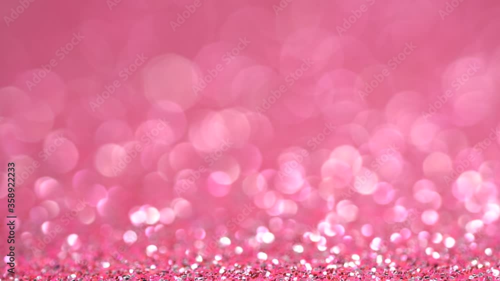 Shiny neon pink gradient surface rotates. Magic holographic bokeh background Shiny neon pink gradient surface rotates. Magic holographic bokeh background