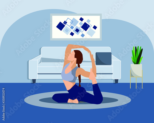 A woman doing healthy yoga in her free time in the living room in the house.