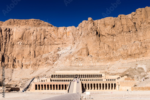 It's Queen Hatshepsut's temple (Dayr el-Bahari or Dayr el-Bahri), part of the Theban Necropolis.