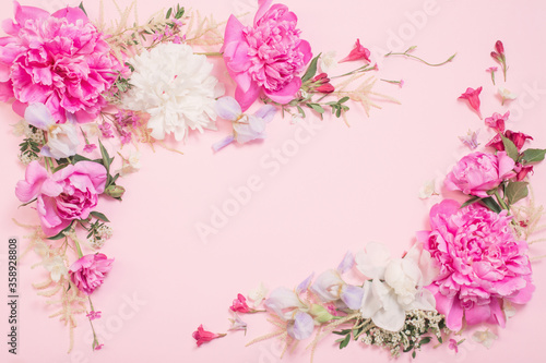 beautiful flowers on pink paper background © Maya Kruchancova