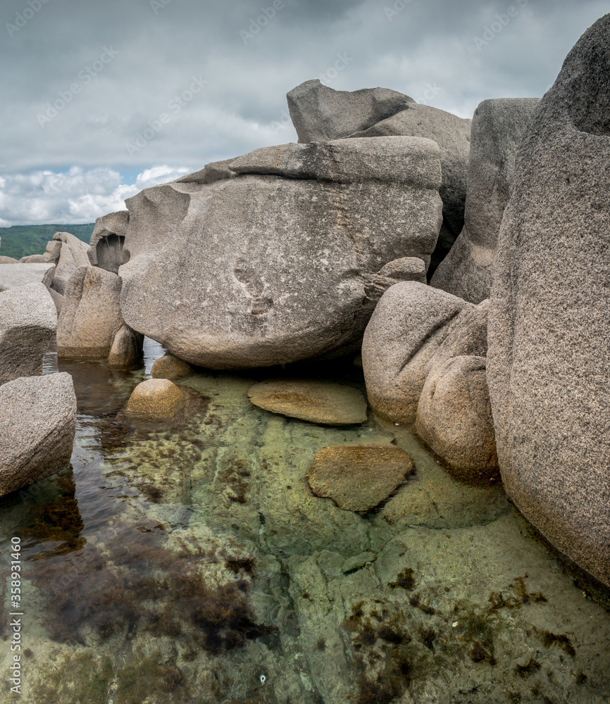 Huge stones in shallow sea
