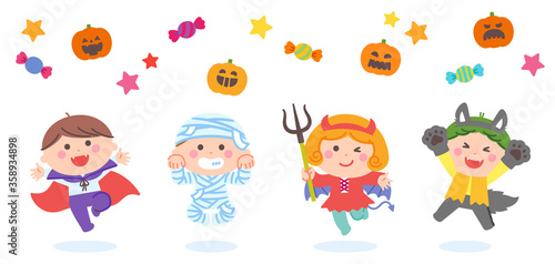 Children jumping in Halloween ghost costumes