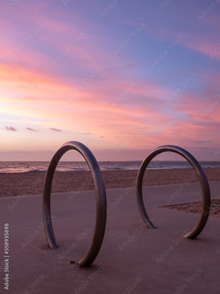 Bicycle racks on the beach at sunset with a beautiful sky Bicycle racks on the beach at sunset with a beautiful sky
