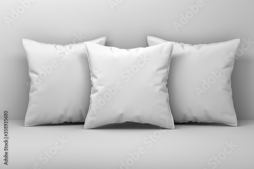 Closeup mockup of three large sleeping blank pillows on white background