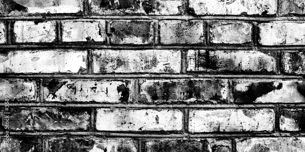 Cracked white brick wall covered plaster. Concrete texture