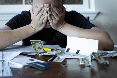 Photography Stressed woman worrying about financial debt and monthly bills