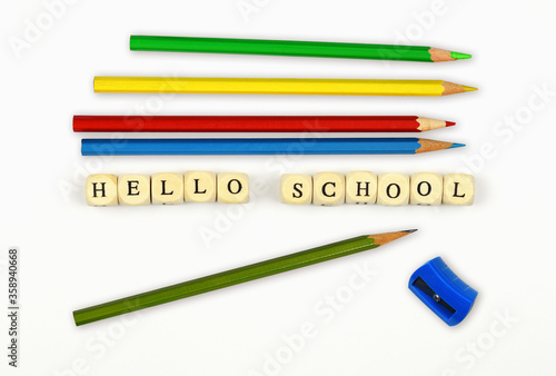 Text HELLO SCHOOL at wooden...