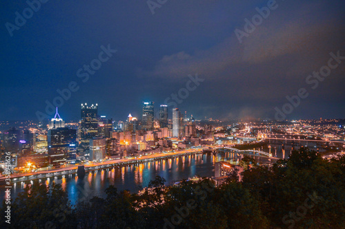 Panorama view of City Pittsburg Skyline along the Ohio River at night