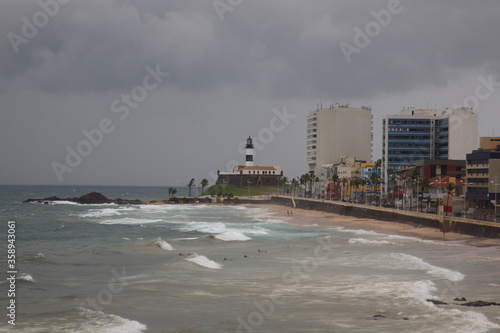 View of farol da barra and city skyline along Salvador beach in Salvador Bahia, Brazil