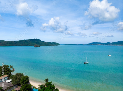 Beautiful top view of sandy beach and clear blue sea at Phuket Thailand.