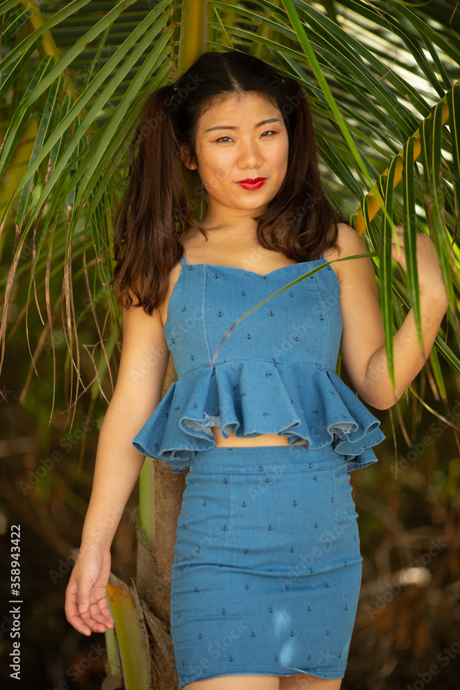 Gorgeous young asian girl posing emotionally with sea waves and horizon on background. Pretty dark-haired girl in sunglasses expressing happiness. Gorgeous young asian girl posing emotionally with sea waves and horizon on background. Pretty dark-haired girl in sunglasses expressing happiness.