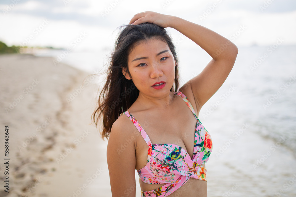 Gorgeous young asian girl posing emotionally with sea waves and horizon on background. Pretty dark-haired girl in sunglasses expressing happiness. Gorgeous young asian girl posing emotionally with sea waves and horizon on background. Pretty dark-haired girl in sunglasses expressing happiness.