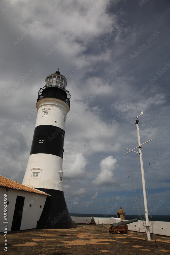 Lighthouse in farol da barra under blue sky Salvador, Bahia, Brazil