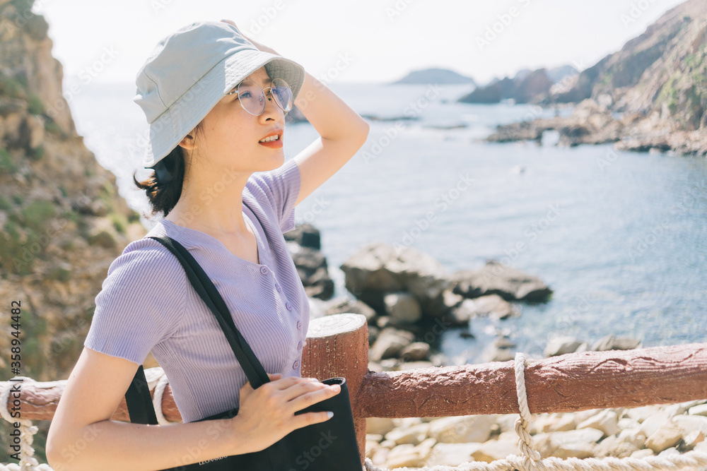 A picture of woman tourist in Eo Gio seaside, Quy Nhon city, Binh Dinh province, Vietnam