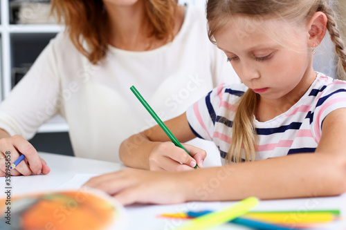 Wallpaper Mural Blond smiling little girl hold in arm pencil drawing something together with mom. Beautiful female young artist, minor baby-sitter, art joy, juvenile development, parent lifestyle, youth, painter Torontodigital.ca