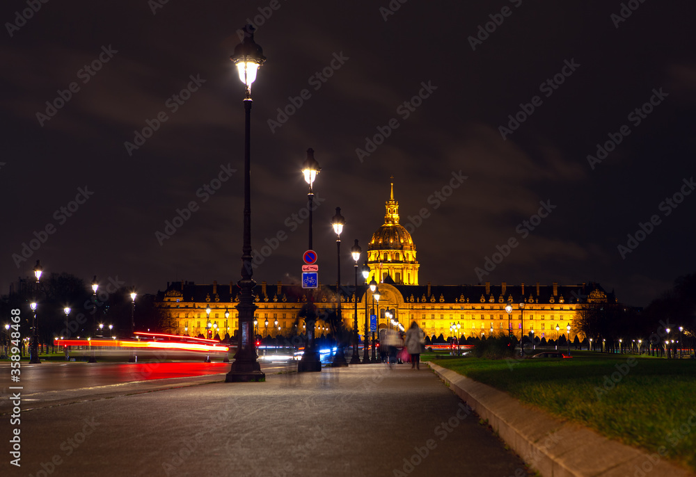 Paris night walk . Famous Invalides Cupola illuminated in the night  
