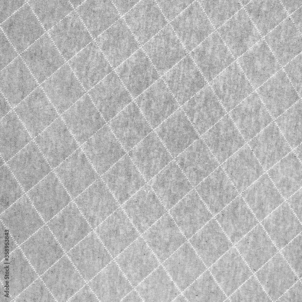 Fototapeta premium Gray fabric with diamond stitching pattern texture background