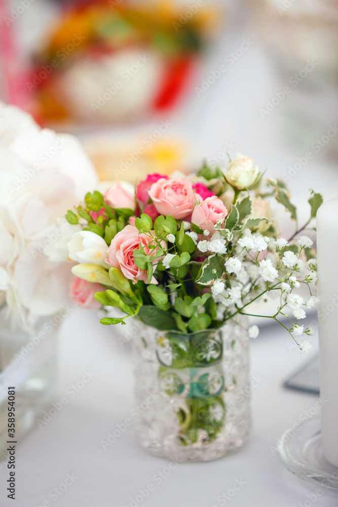 Delicate wedding bouquet of pink and white roses