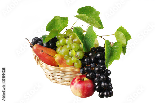 Grapes in a basket, pears, apples on a white background.Isolated on white.