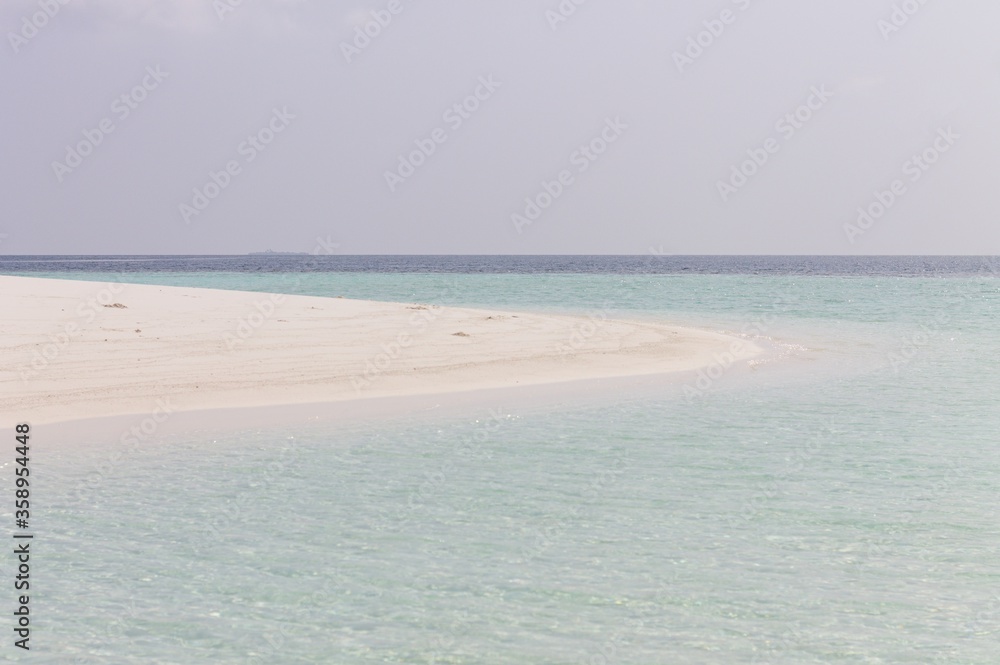 A desert island with a white sand in the Indian ocean (Ari Atoll, Maldives, Asia)