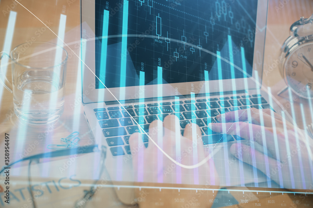 Multi exposure of market chart with man working on computer on background. Concept of financial analysis. Multi exposure of market chart with man working on computer on background. Concept of financial analysis.