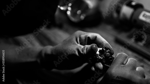 close-up. b/w. The jeweler makes a silver ring. On the island of Bali. Indonesia