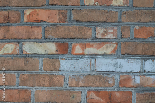 The wall is made of bricks. Brick structure. Ceramic tile.