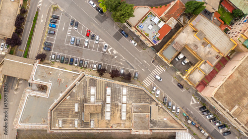 Orthogonal aerial view on a square with parked cars
