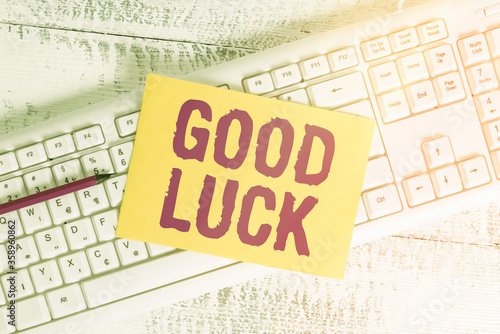 Text sign showing Good Luck. Business photo showcasing expressing hope for someone to be successful with their circumstances White keyboard office supplies empty rectangle shaped paper reminder wood photo