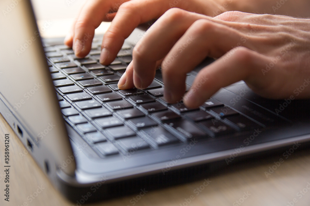 hands typing on a keyboard hands typing on a keyboard