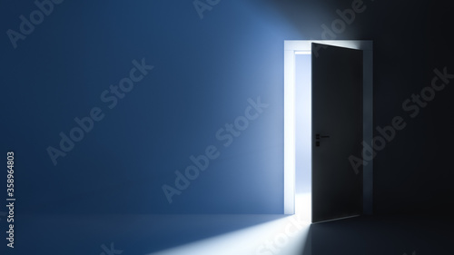 Bright light behind the slightly ajar door. Abstract background. photo