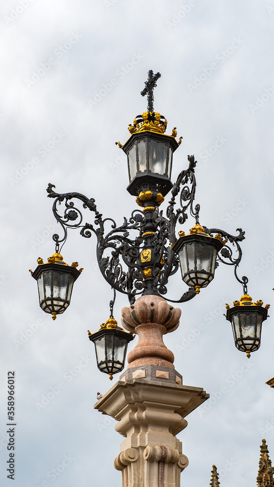 It's Lamp post near the Seville Cathedral, Roman Catholic cathedral in Seville,Spain. It's Lamp post near the Seville Cathedral, Roman Catholic cathedral in Seville,Spain.