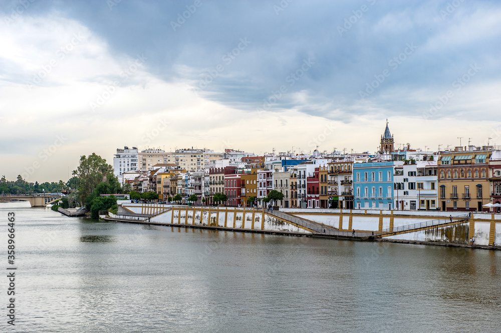Fototapeta premium It's Guadalquivir river coast and architecture of Seville, Andalusia, Spain.