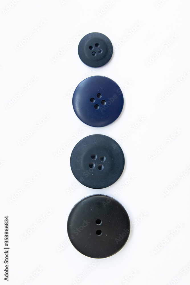 black buttons for clothes on a white background black buttons for clothes on a white background