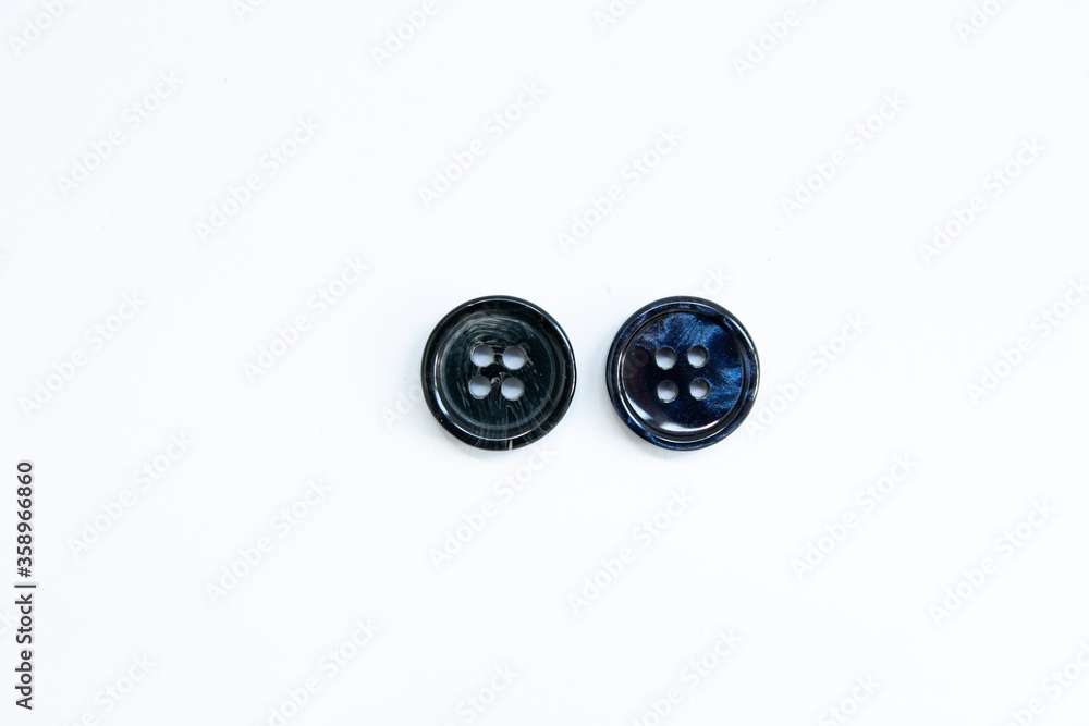 black buttons for clothes on a white background black buttons for clothes on a white background