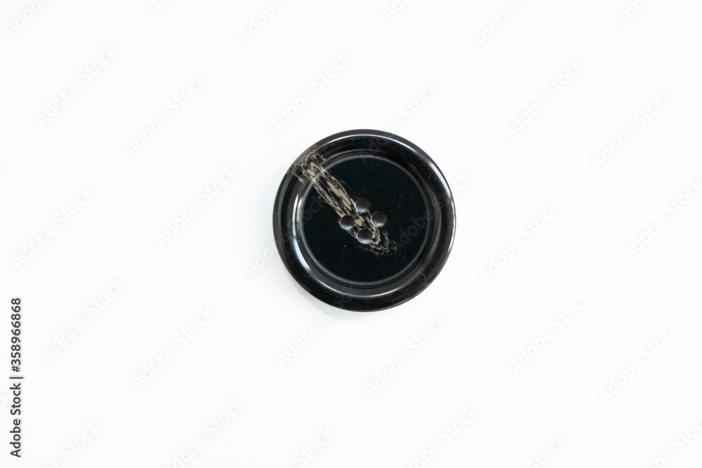 black buttons for clothes on a white background black buttons for clothes on a white background