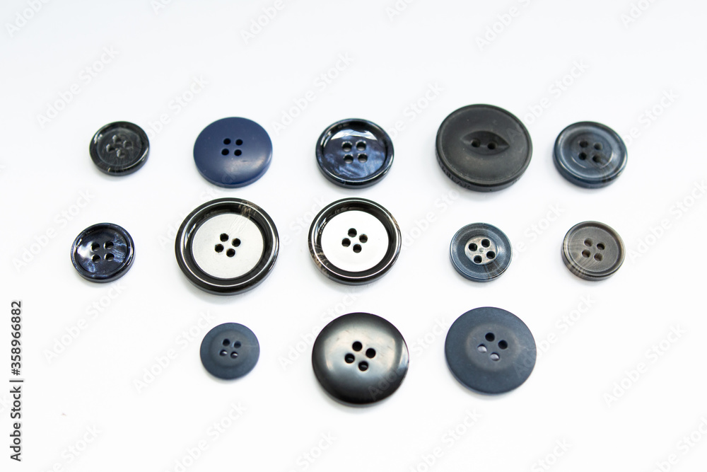 black buttons for clothes on a white background black buttons for clothes on a white background