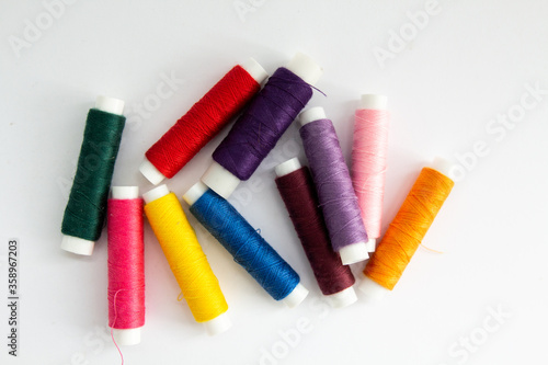 collage of threads for sewing different colors