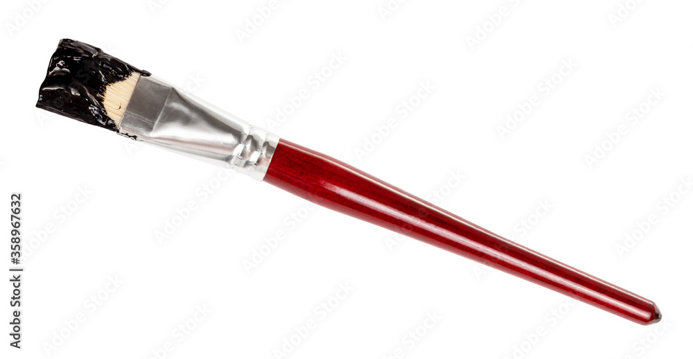 flat paint brush with black colored tip and brown handle isolated on white background flat paint brush with black colored tip and brown handle isolated on white background