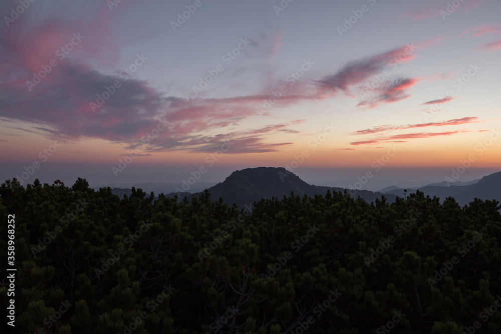Colorful clouds at sunset above mountains in Poland Colorful clouds at sunset above mountains in Poland